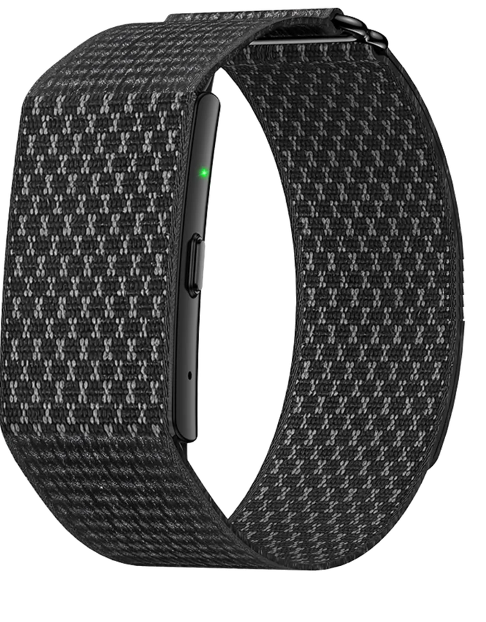 Kira Band in Graphite: black woven nylon loop with a black module, its green status light lit